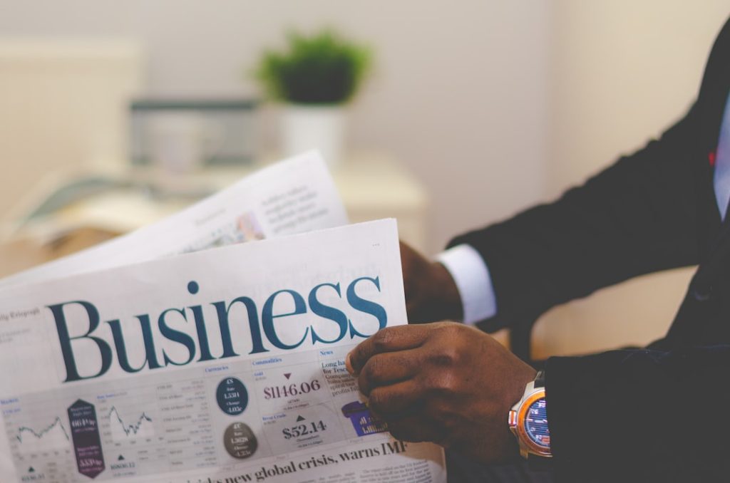 person-wearing-suit-reading-business-newspaper-e7rlgujjazc Businessman opening a paper